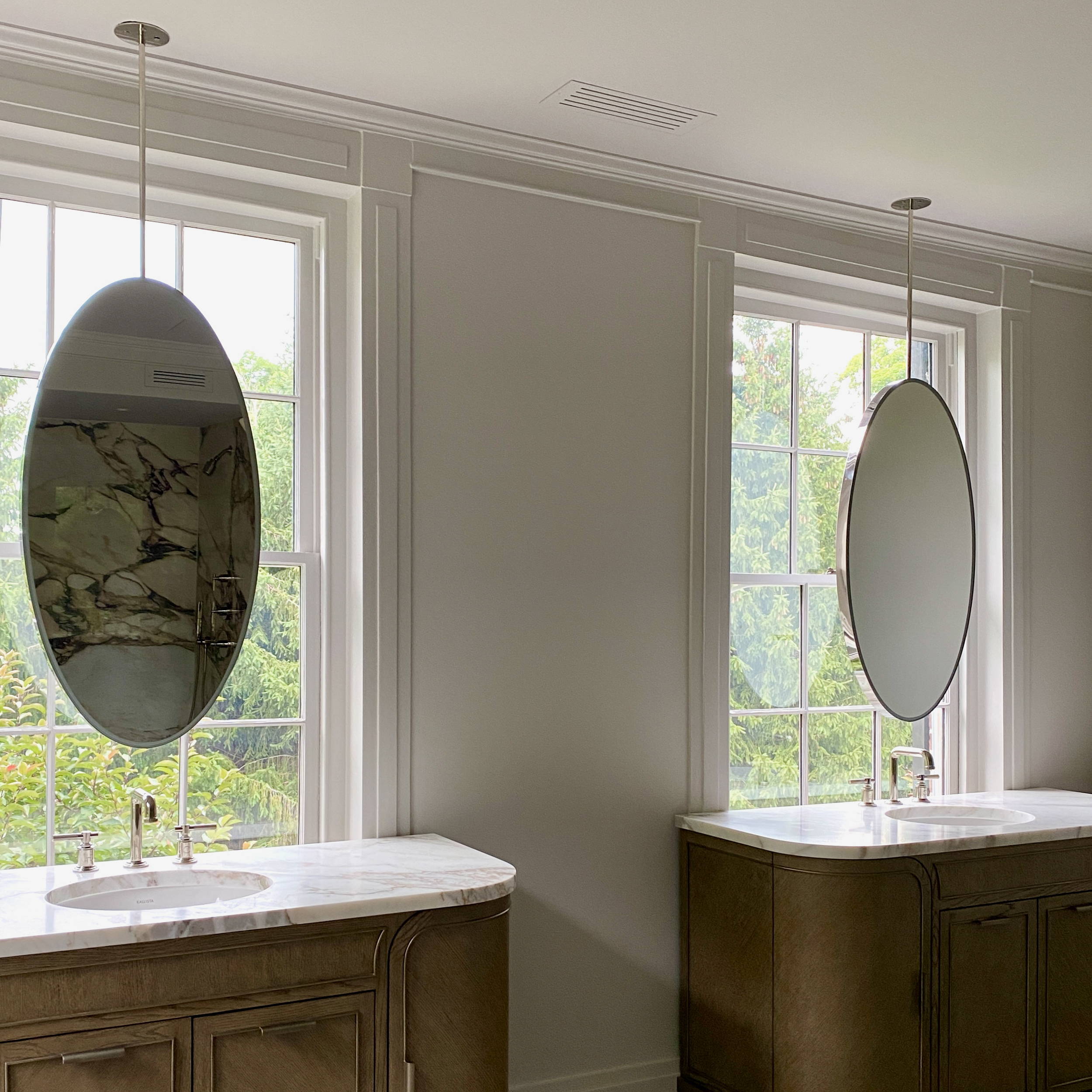 Ceiling Suspended Ovalis™ mirror for Mackenzie Reid Design, US