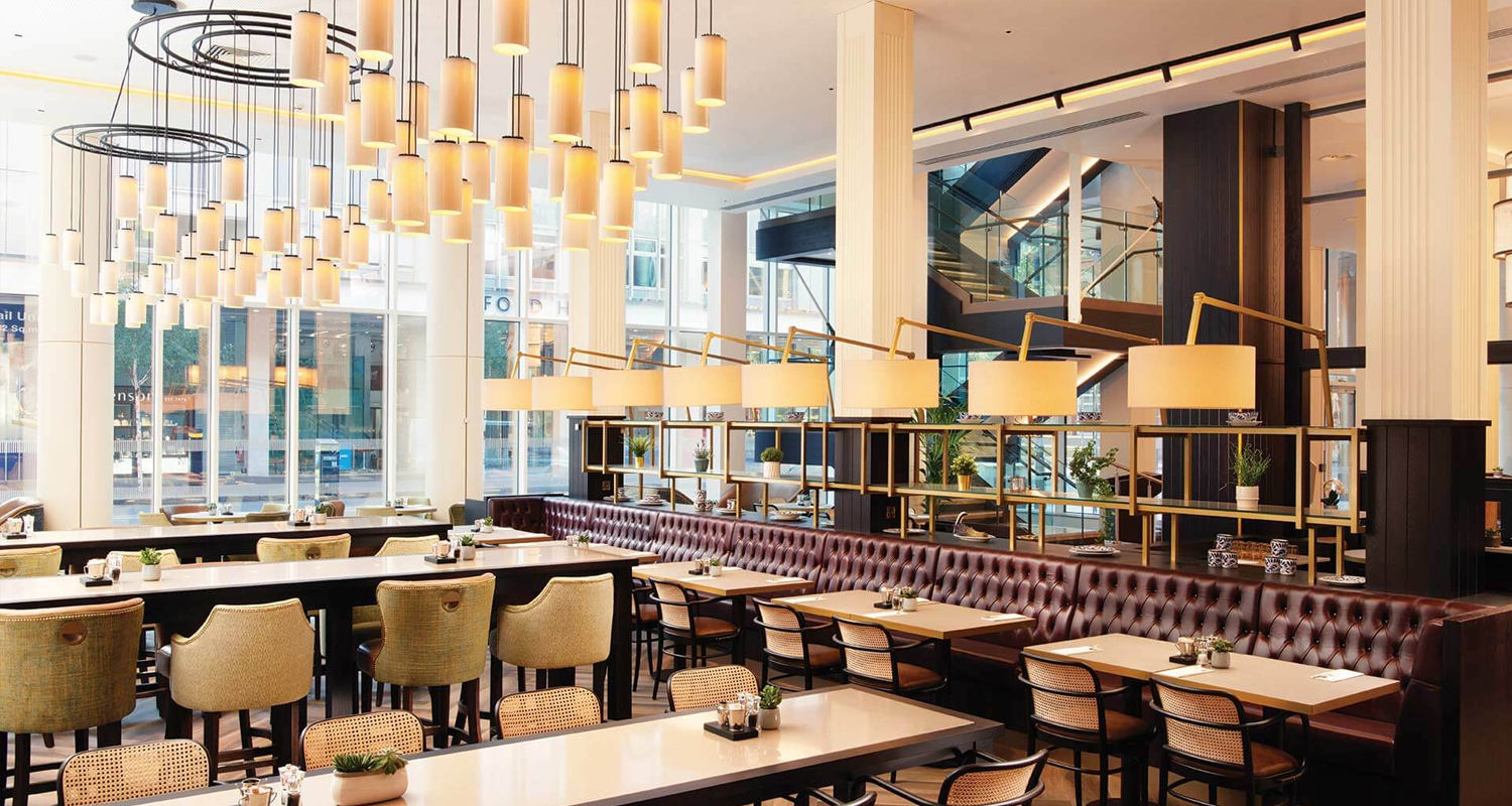 Restaurant view of cylinder pendant lampshades and drum shades at the Grand Central Hotel Belfast