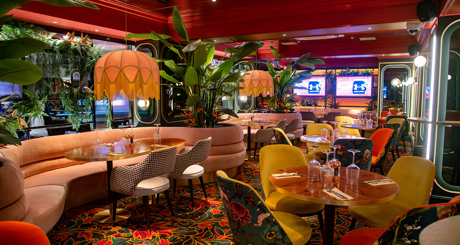 Soft pink silk dome lampshades with gold fringe at the casino restaurant 