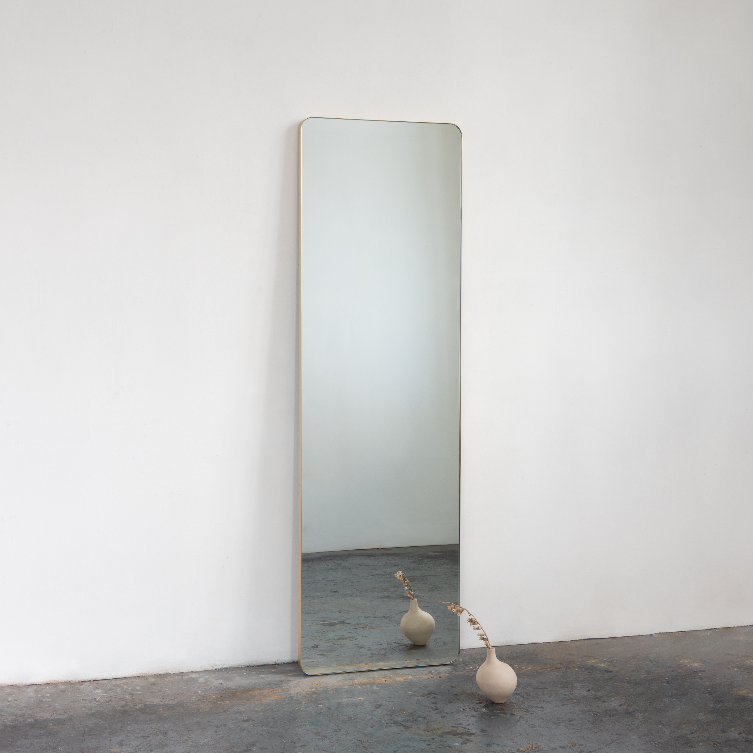 Wall-leaning Quadris™ Rectangular Mirror with Minimalist Brushed Brass Frame