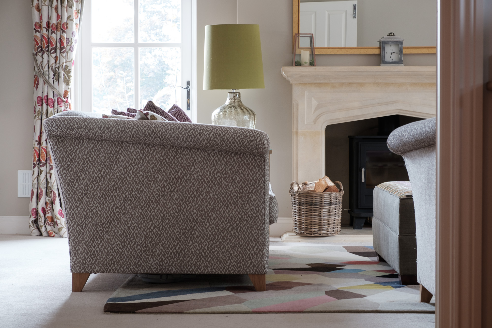 Patterned rug and sofas