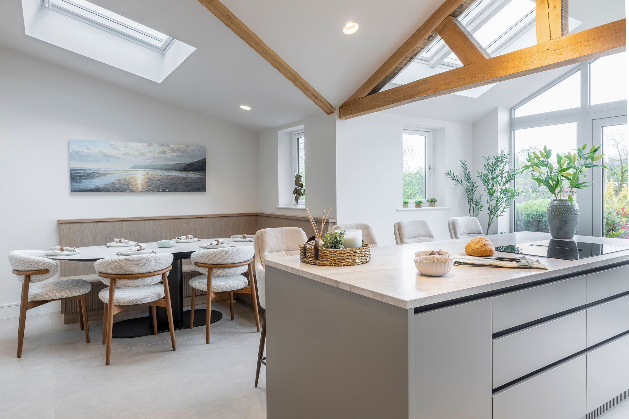 Luxury kitchen with taj mahal stone worktops and reeded oak bespoke cabinetry