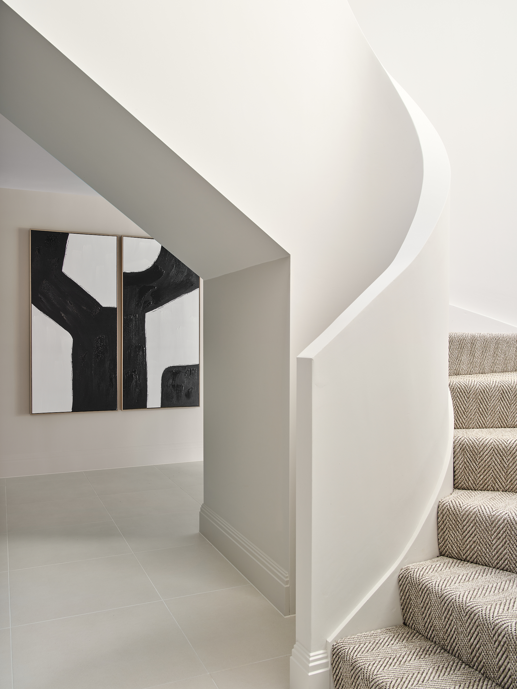 Curved staircase with fully fitted carpet to access cinema and bar