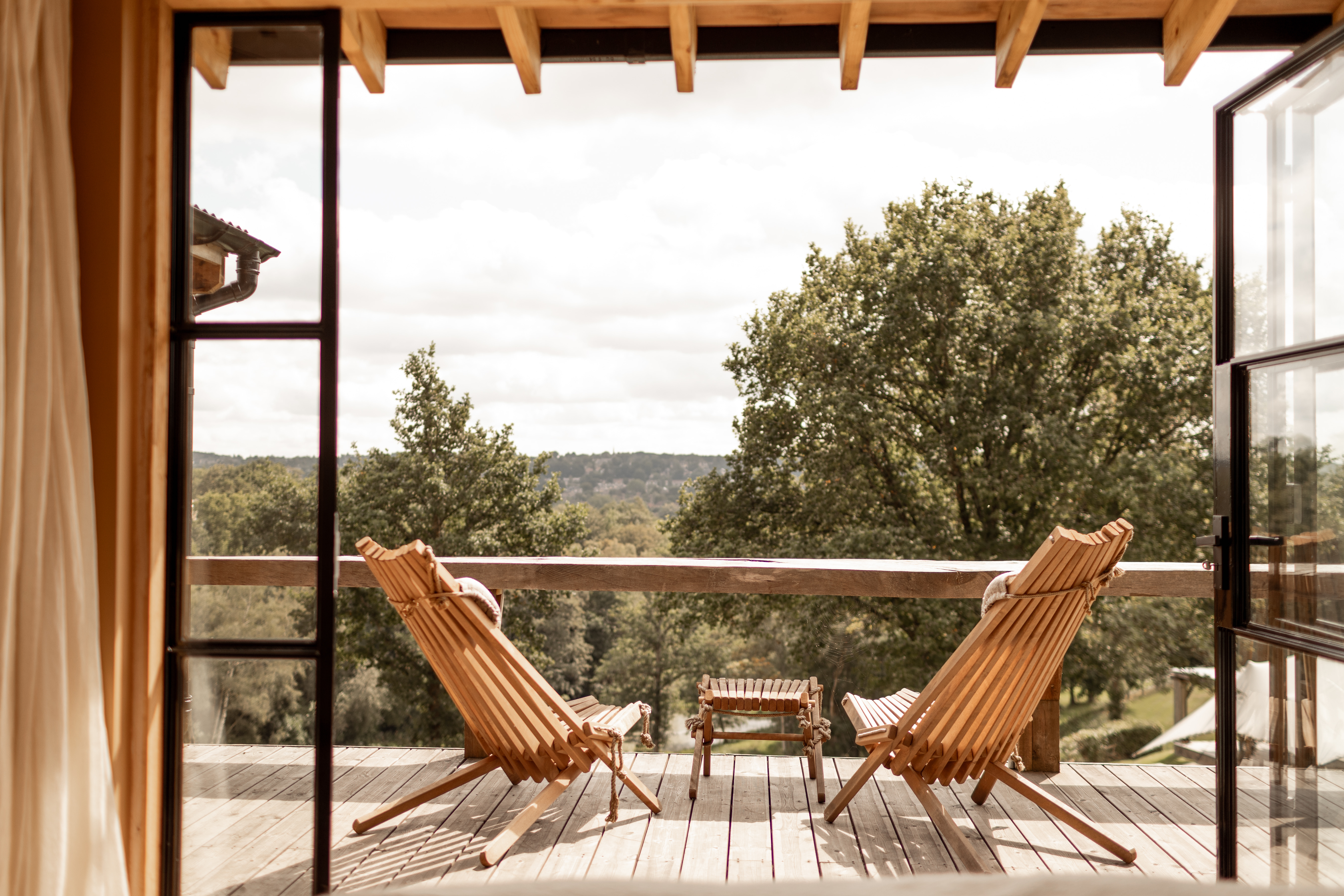 Timber clad guest room at The Beacon with private terrace and metal outdoor fireplace