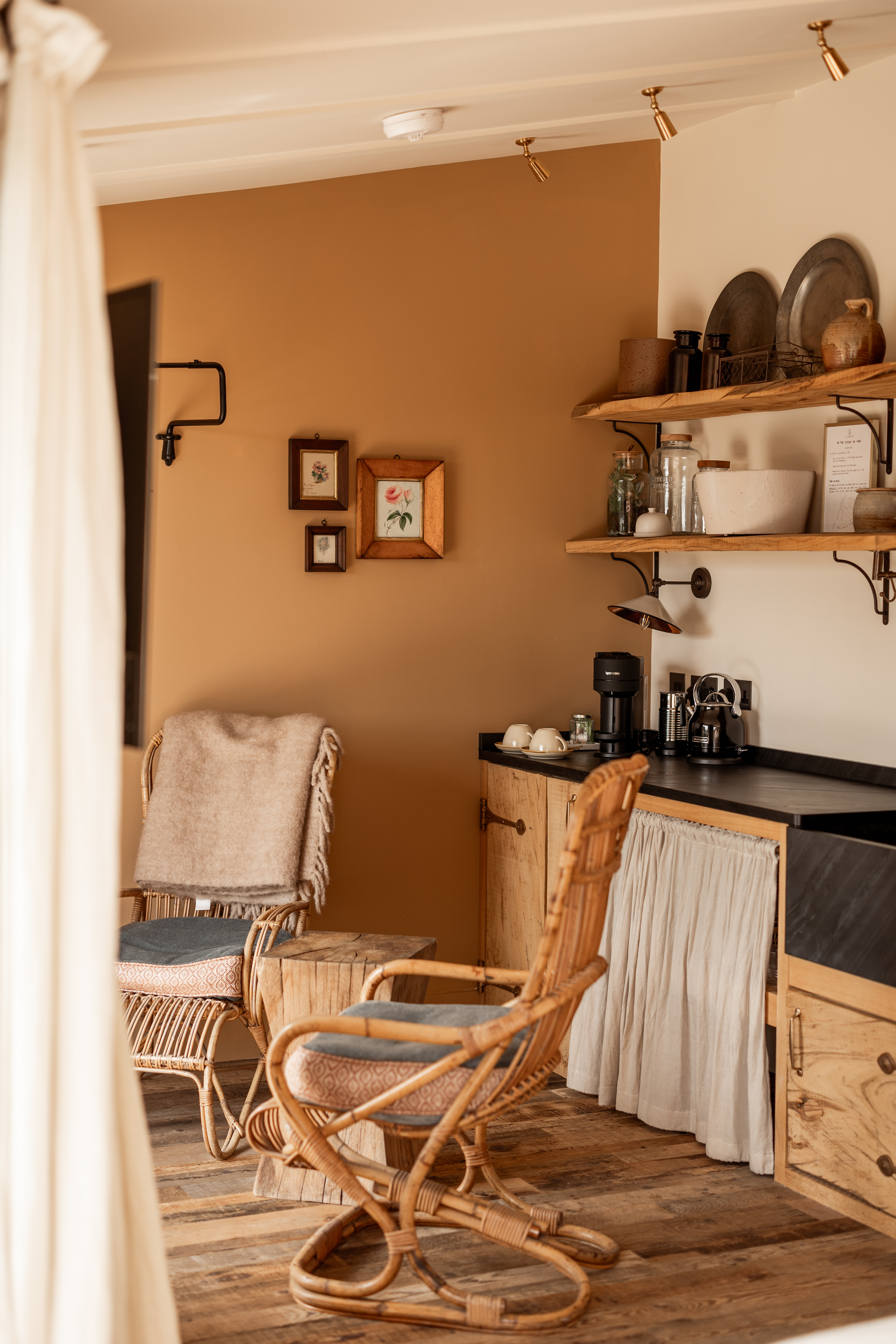 Mohair cushions have been added to the antique cane chairs and oak kitchen with slate sink and worktops