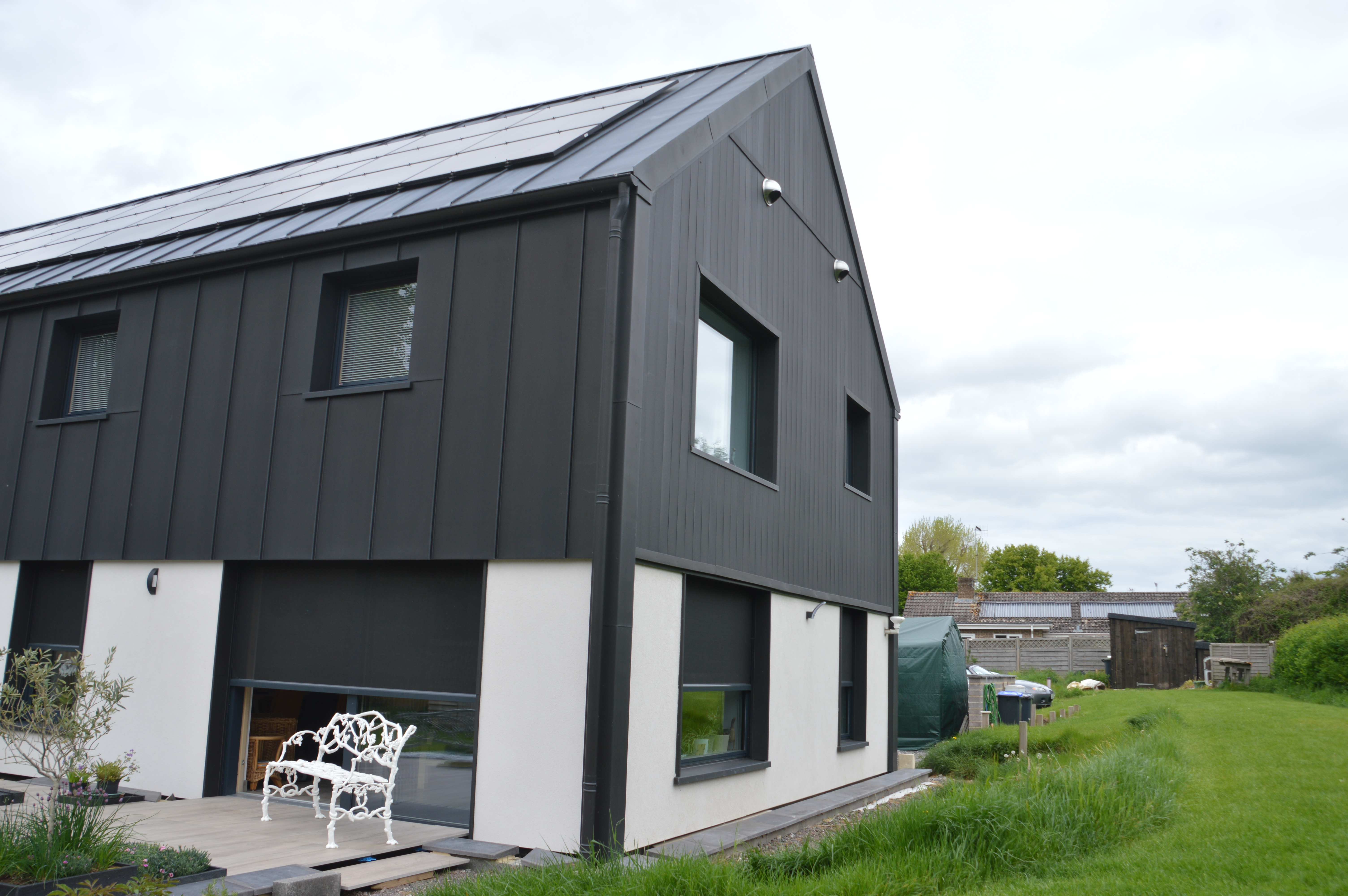 Phantom Screens’ solar screens installed on a Passive House, supporting energy efficiency and comfort