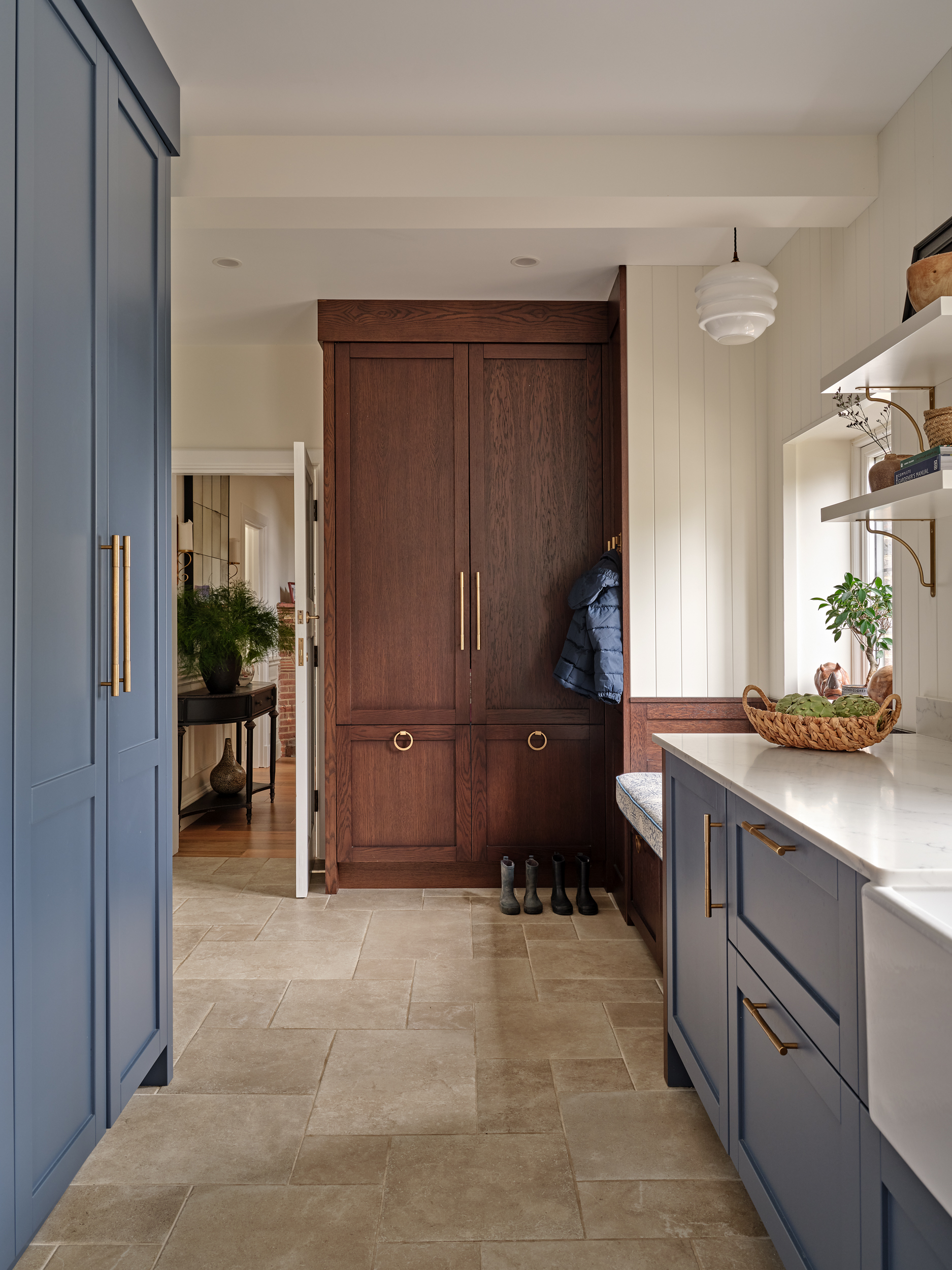 Bespoke joinery in utility room.  Tall storage units, low level cabinetry with sink. Window seat incorporated.