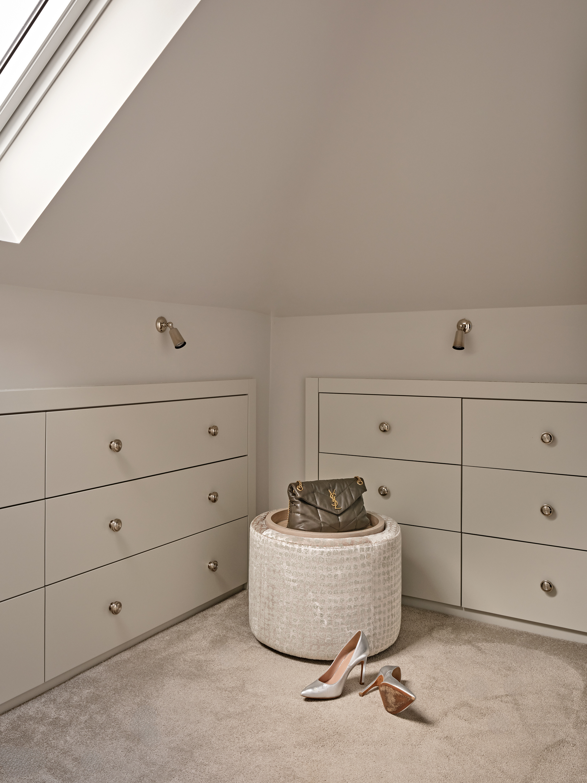 Bespoke joinery in dressing room. Eaves storage. Bespoke upholstered ottoman with removable stained oak tray.