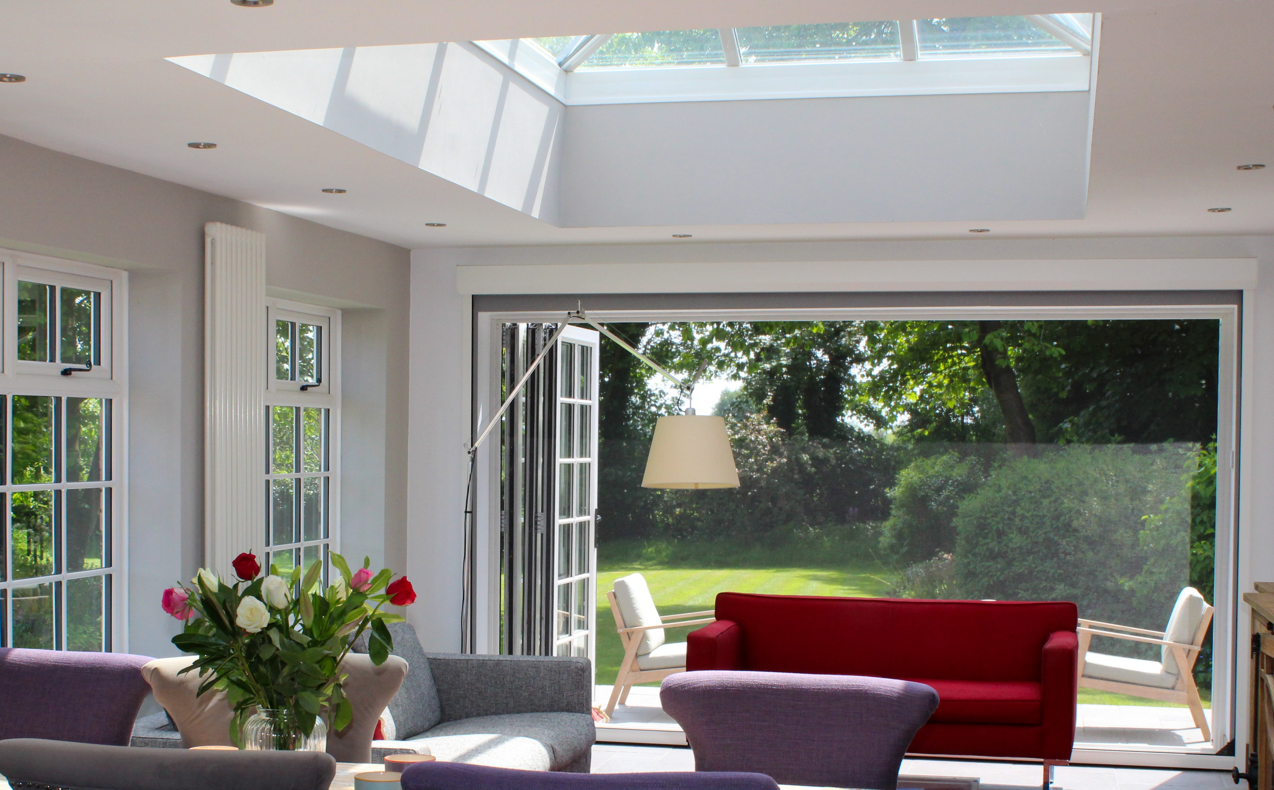 Phantom Screens installed on large bifold doors in a Cheshire countryside home, blending functionality and style