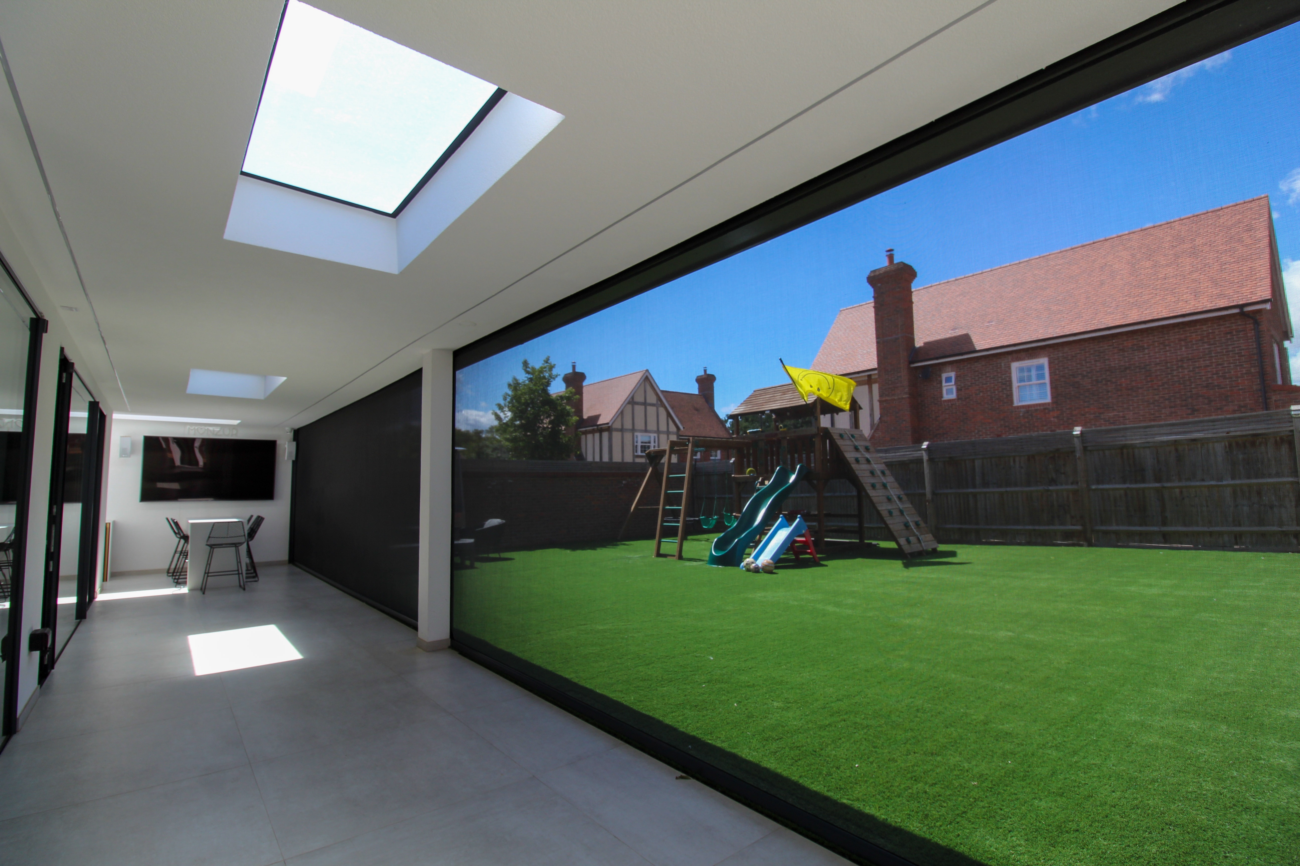 Phantom solar screens blending into the facade, preserving uninterrupted views of the surrounding landscape