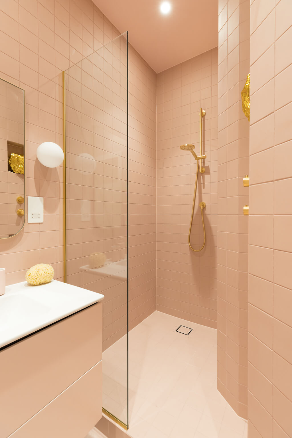 Retro tiled pink and gold bathroom