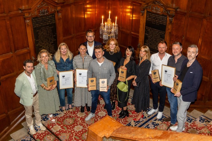 group of winners with their awards