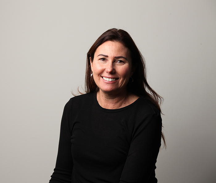 dark haired smiling woman