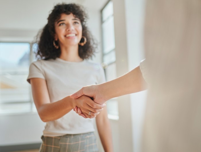 young woman shaking hands with someone