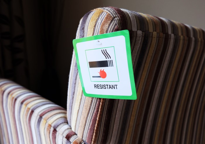 Fire Resistant label on a striped chair