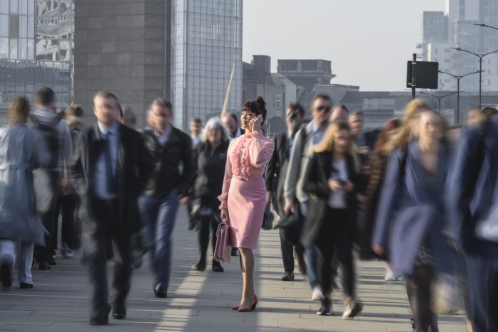 woman in a pink dress in a crowd
