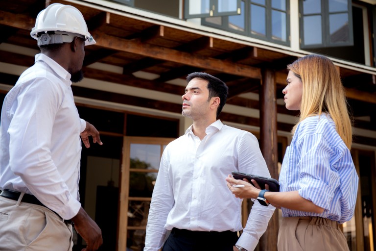 Surveyor talking to people