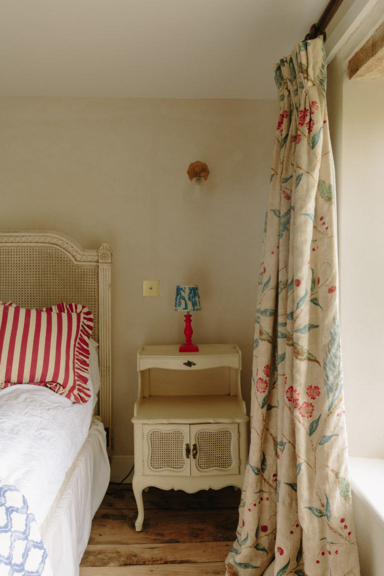 Bedroom with bedside table and curtain