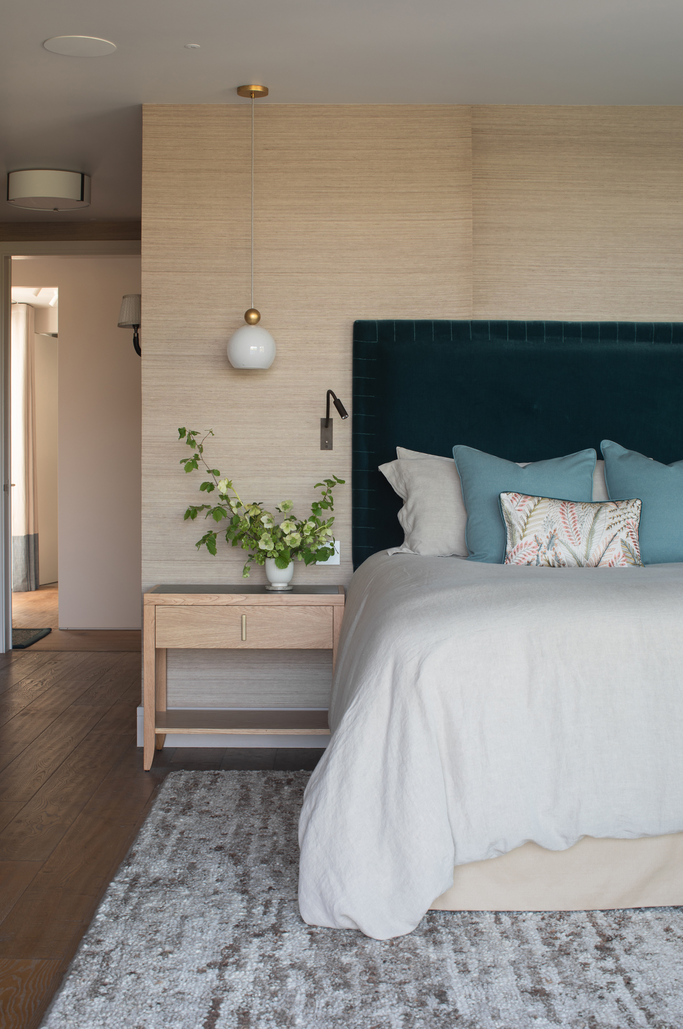 Serene bedroom within a contemporary riverside new build, fully designed and furnished as part of a high-end, turnkey interior architecture project with bespoke finishes and layered lighting.