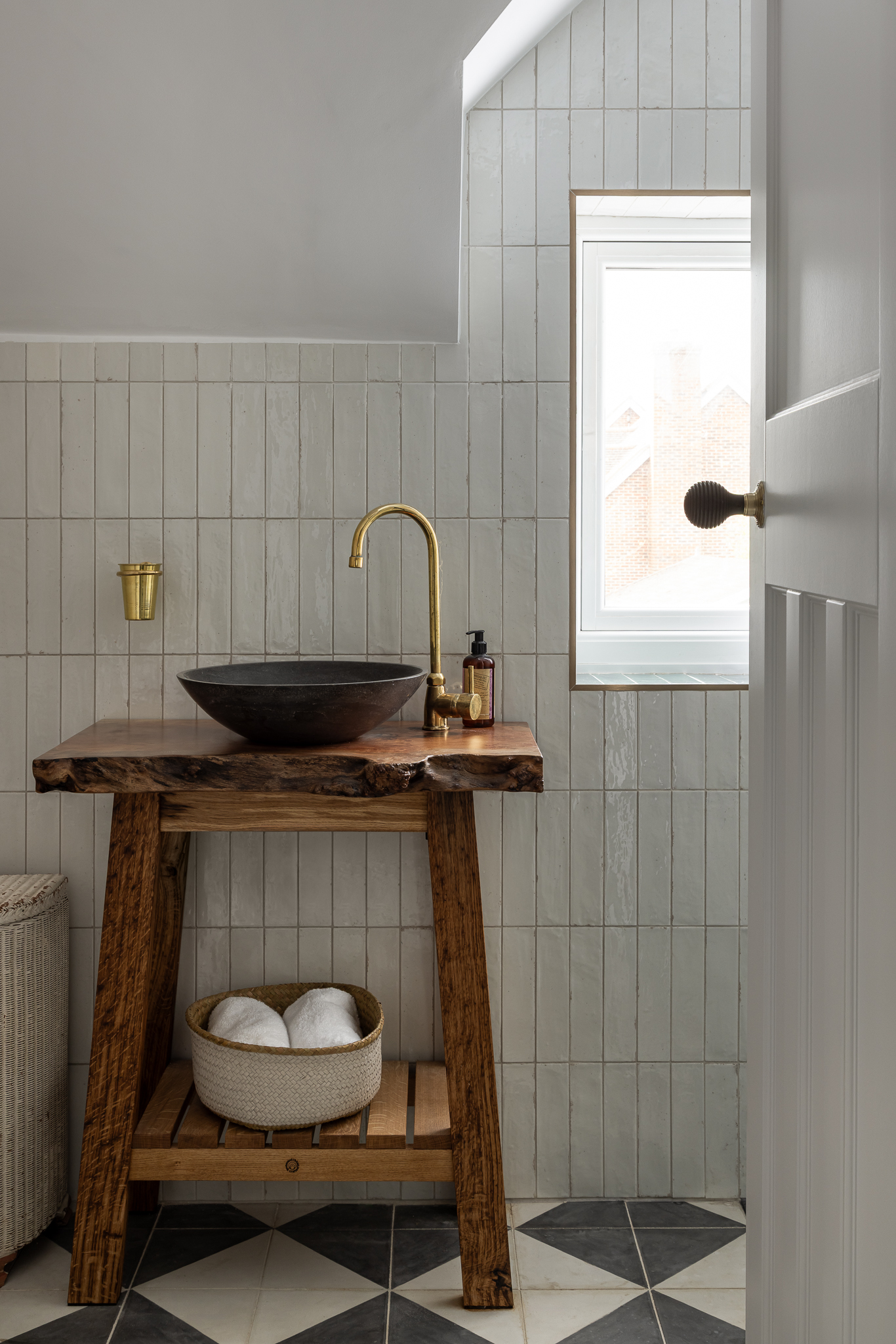 New family bathroom including bespoke vanity cabinet made from felled ash dieback