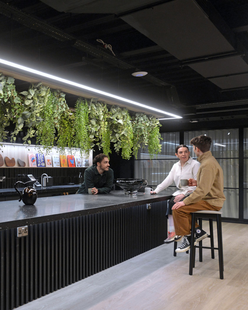 people on stools at a bar