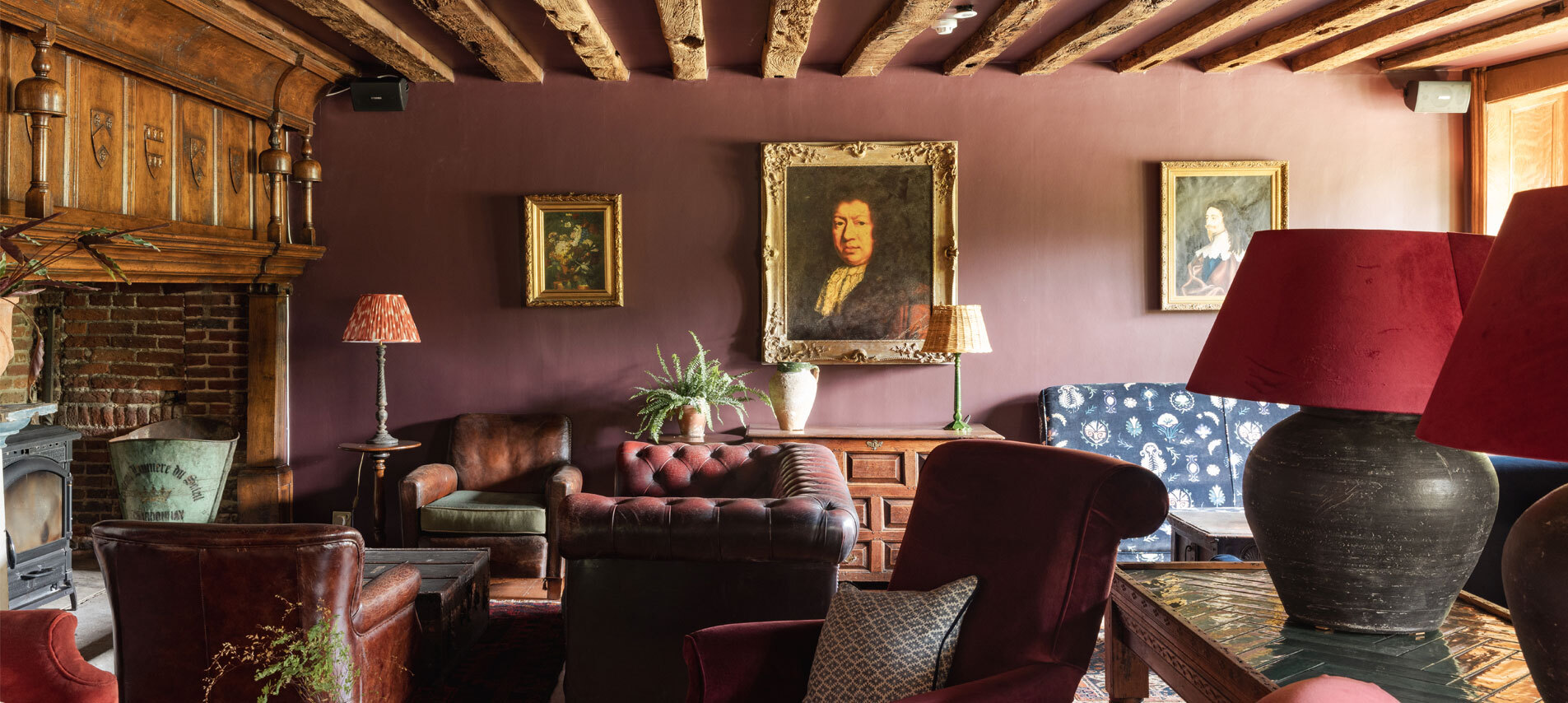 Living room with armchairs and artwork on walls