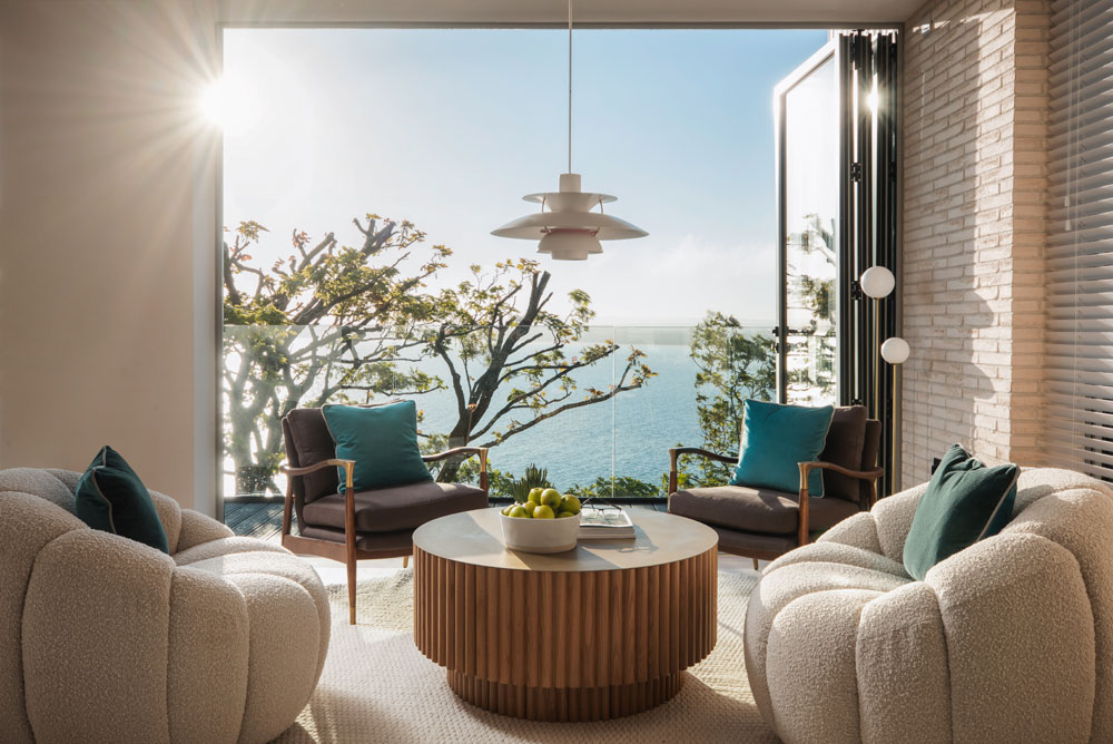 Lounge seating and open balcony doors