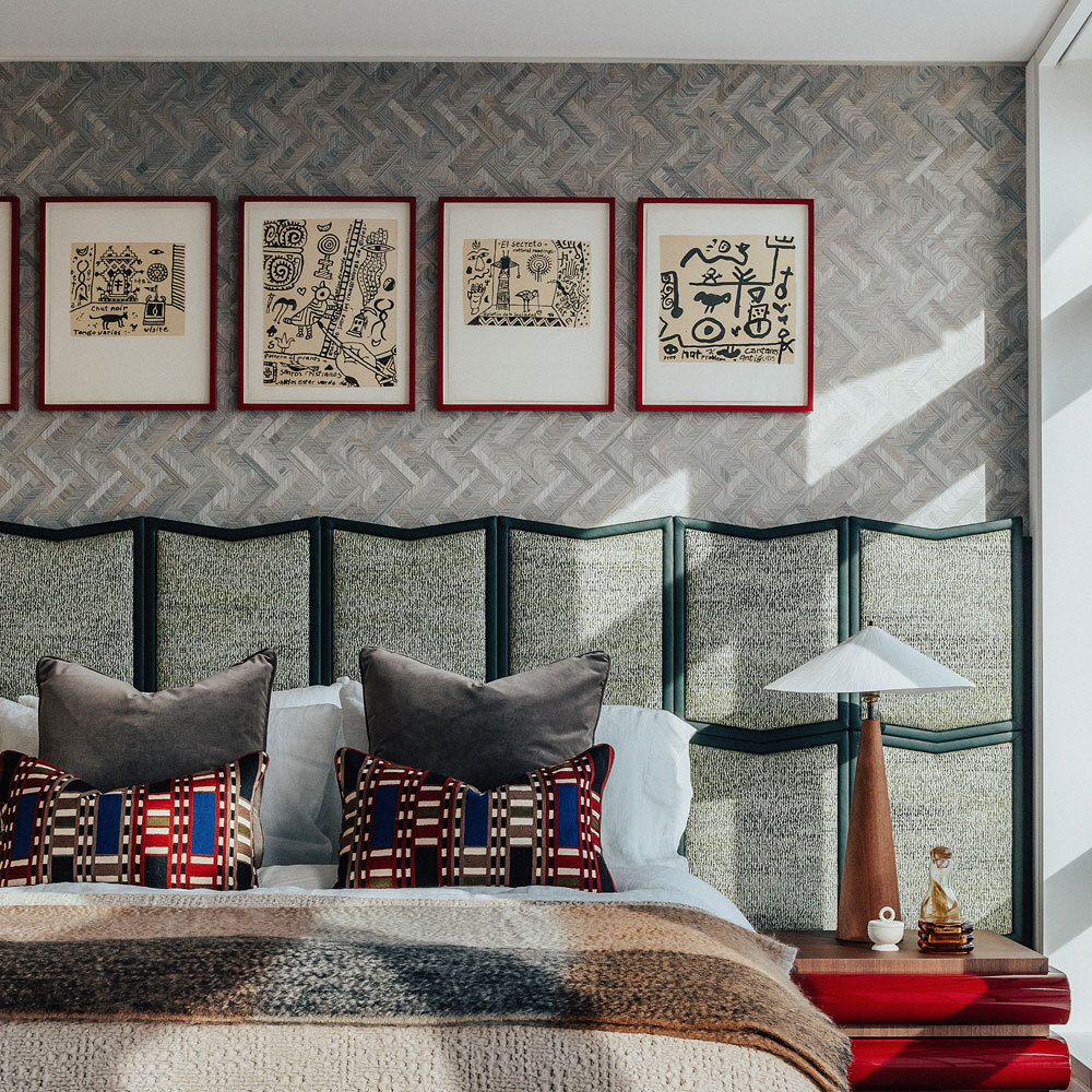 Bedroom with bed and artwork