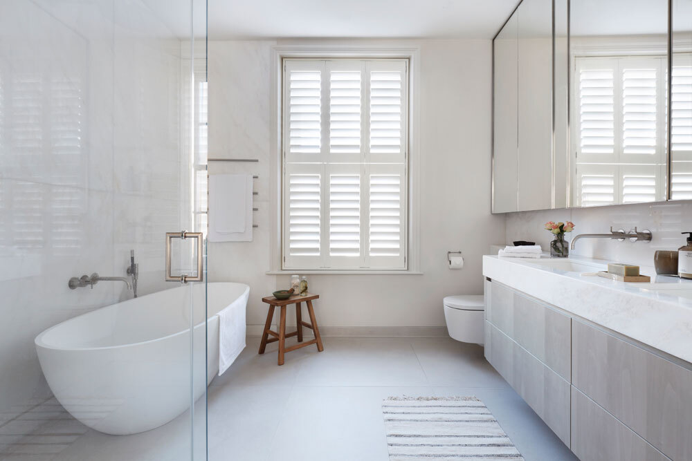 Bathroom with bath and sinks