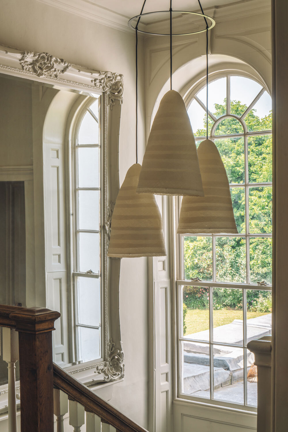 Lighting infront of arched window 