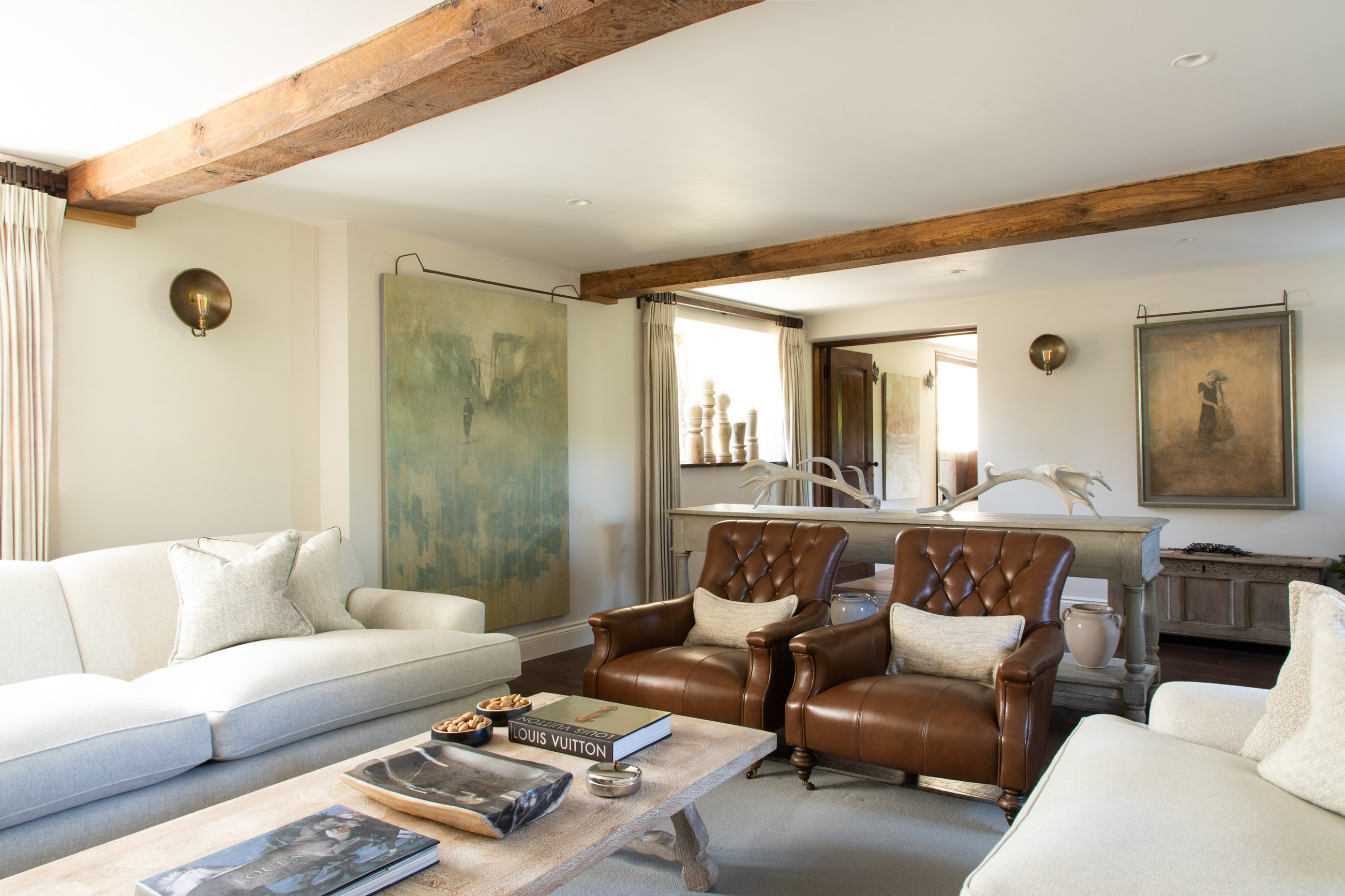 Living room seating with art work on walls