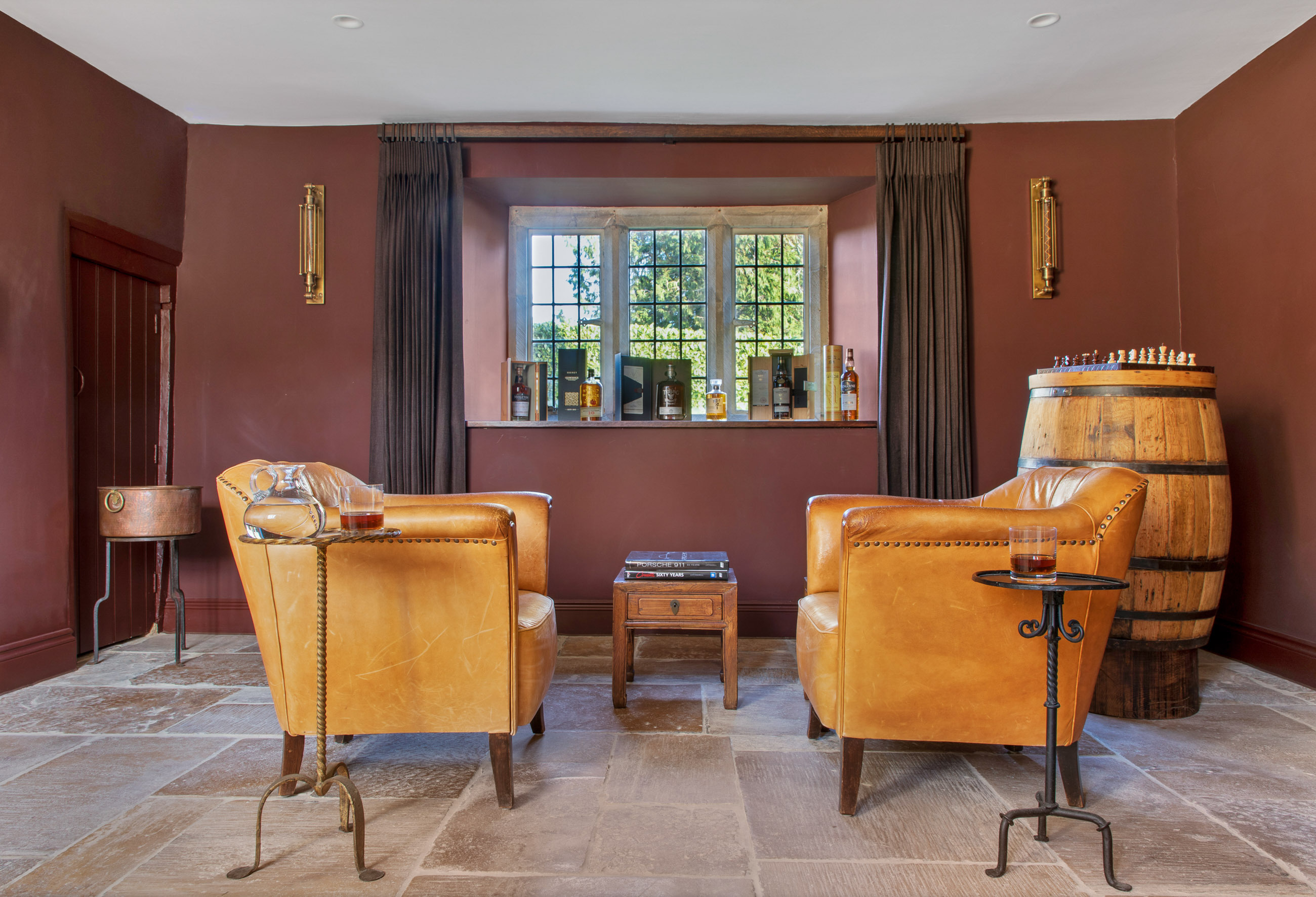 Two armchairs with side tables