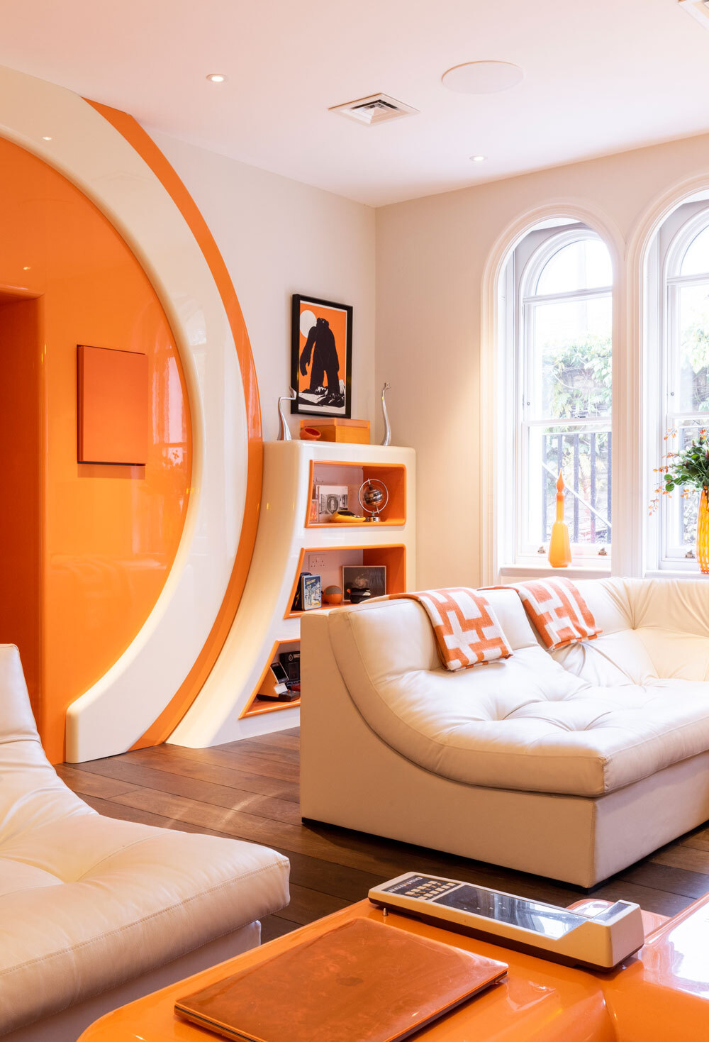 Bold coloured living room wall with sofa