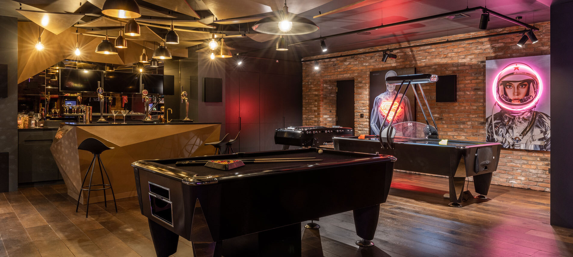 Games room with dark lighting 