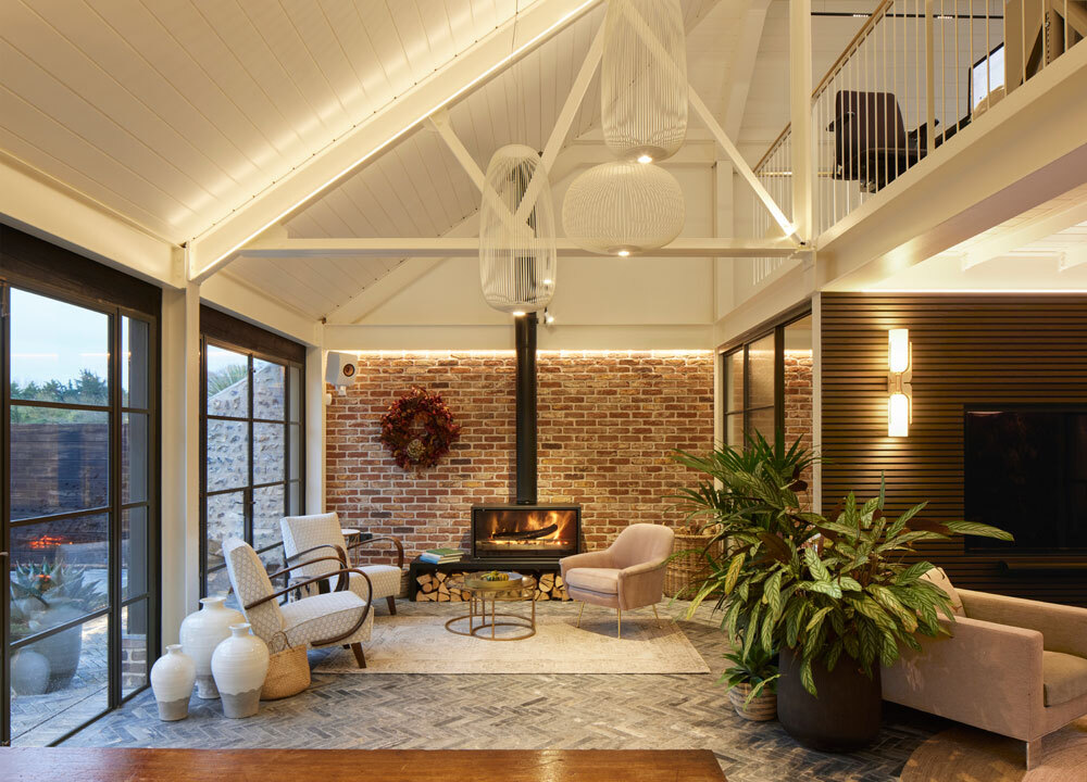 Living space with log burner and high ceilings