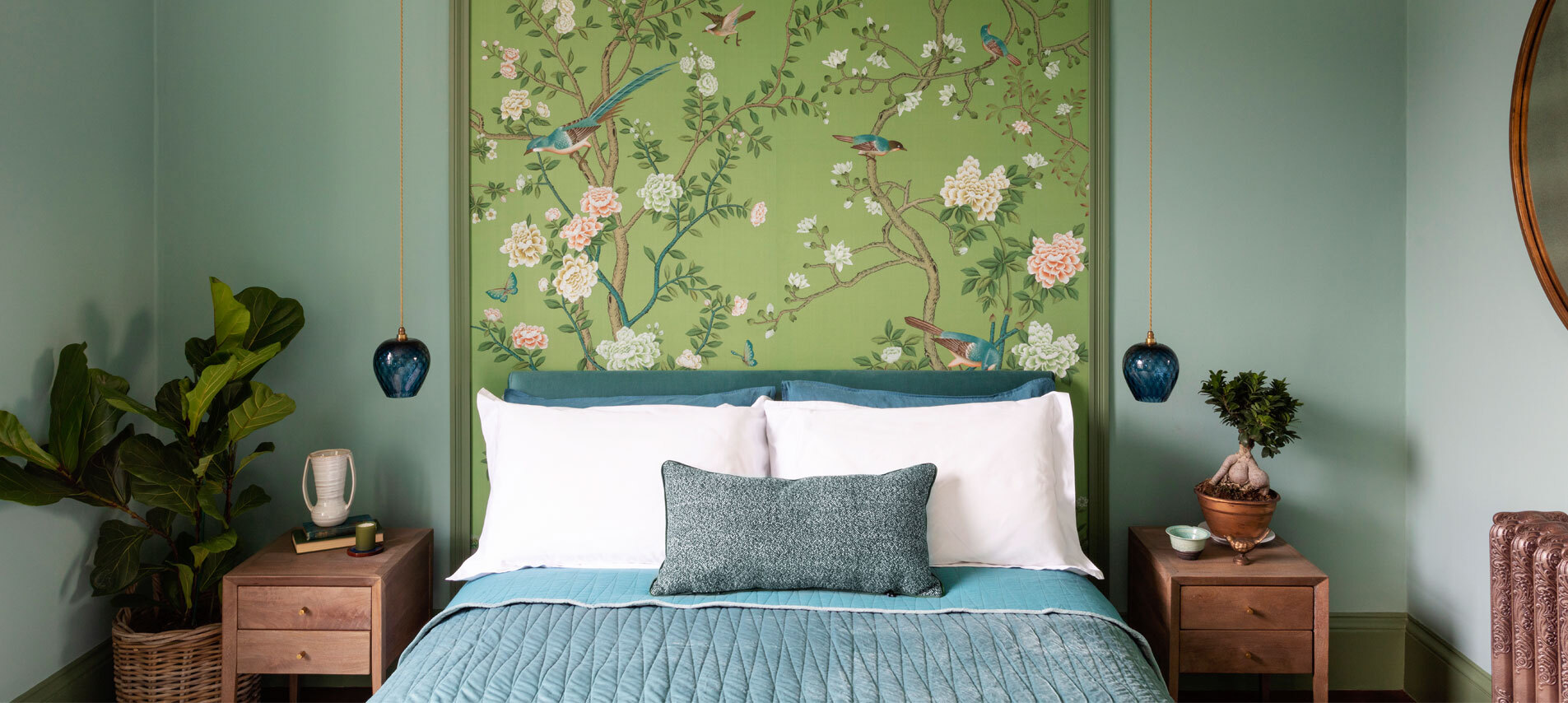 Bedroom with floral wallpaper as headboard