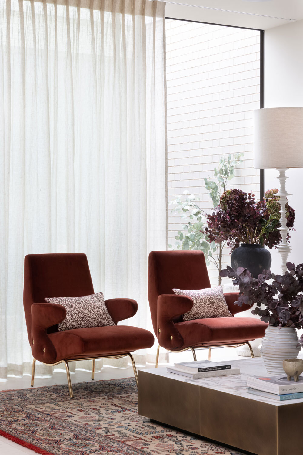 Two chairs infront of window