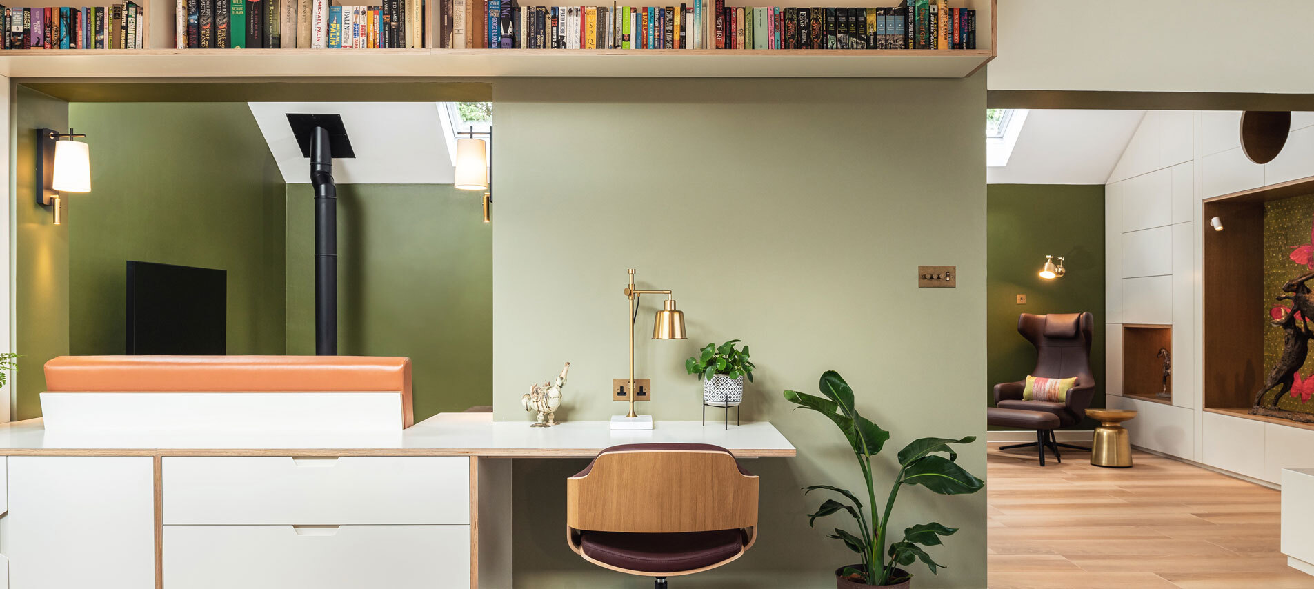 Desk area with bookshelf attached to wall