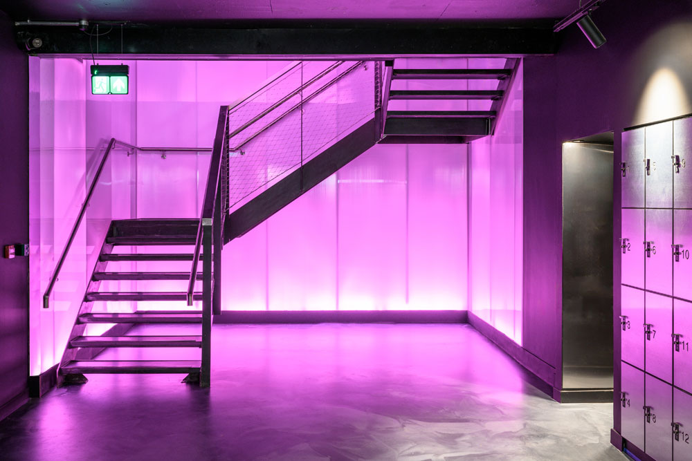 staircase lit with pink lighting