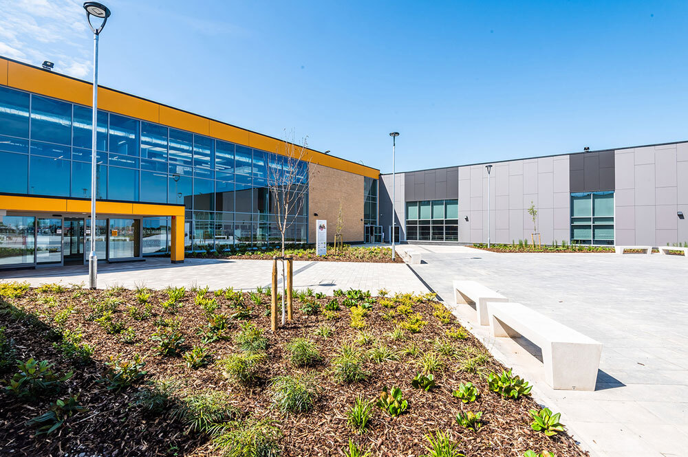 Outside large building with grass