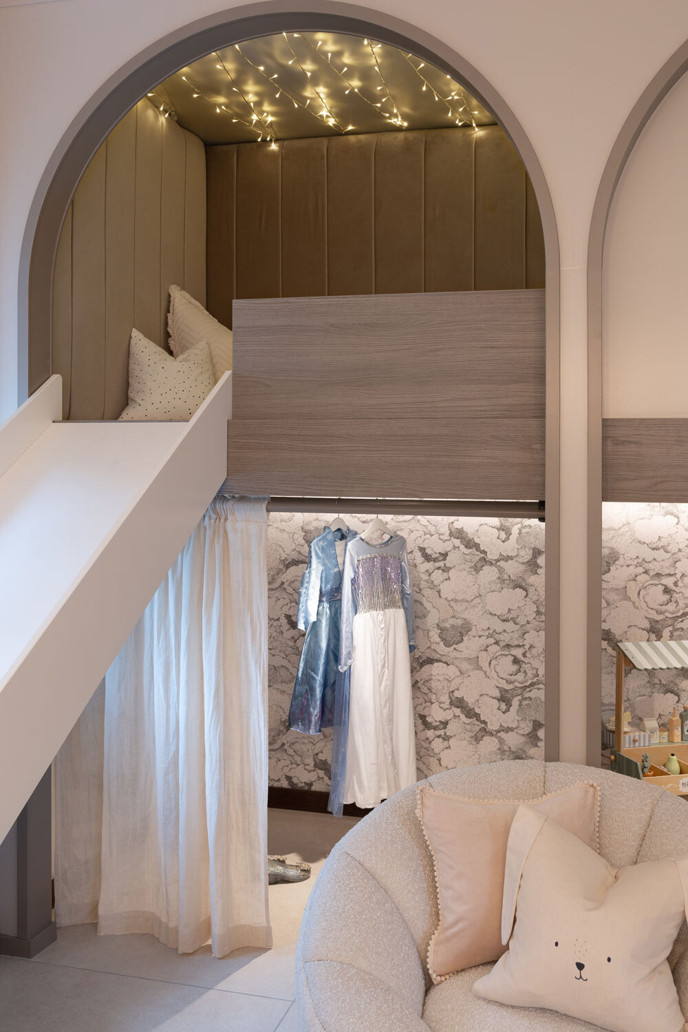 Slide coming our of arched space in playroom