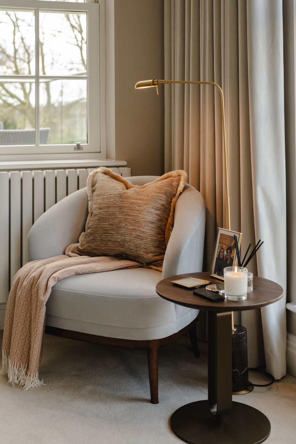 Small side table and comfortable chair.