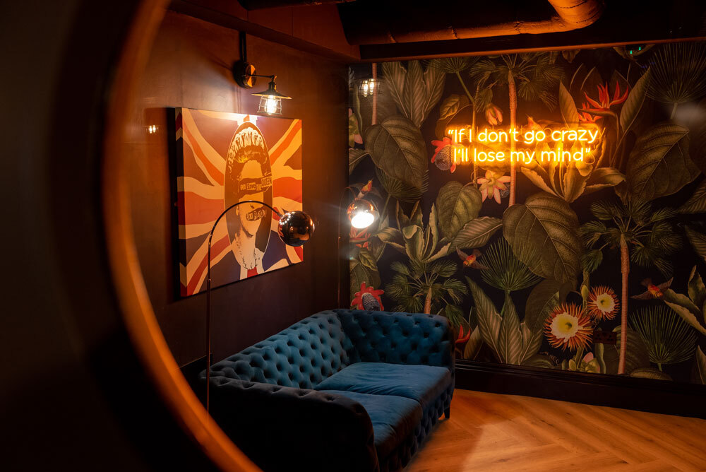 Seating area with art work on walls