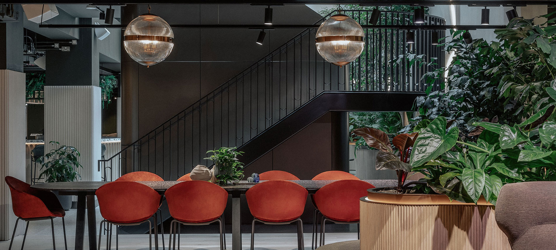 long table with red chairs.