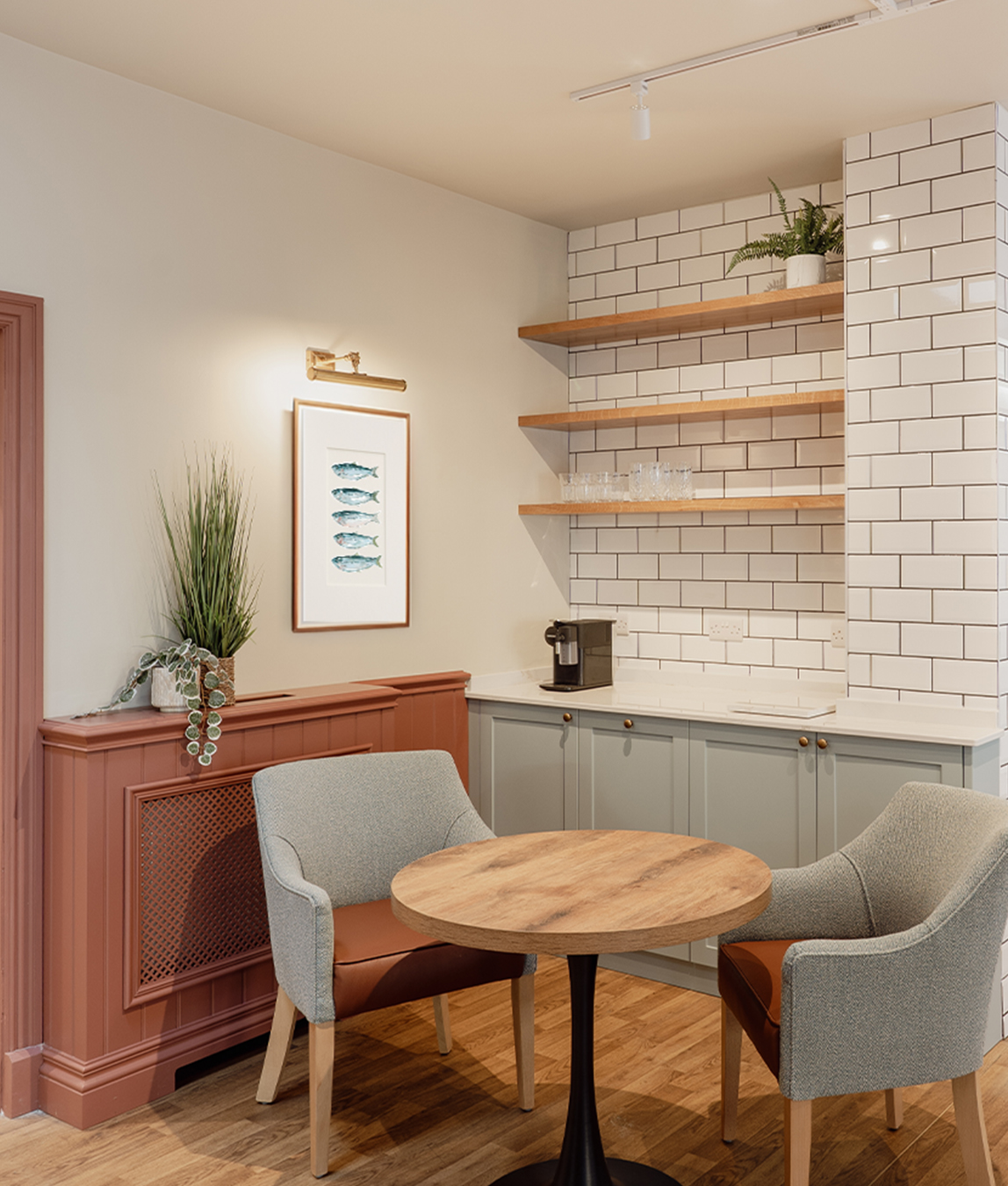Compact coffee station with open shelving and seating