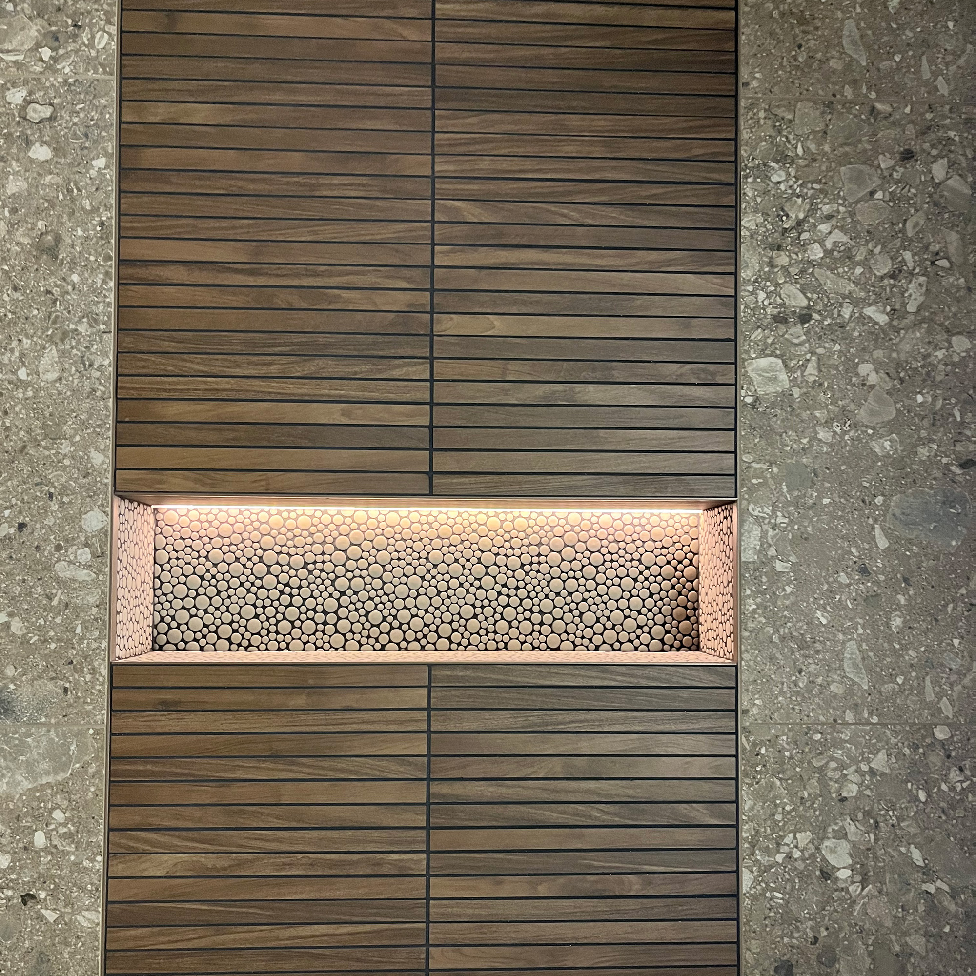 A wall niche is illuminated with LED lighting