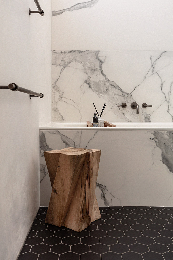 Master ensuite finished with marble and monochromatic details,