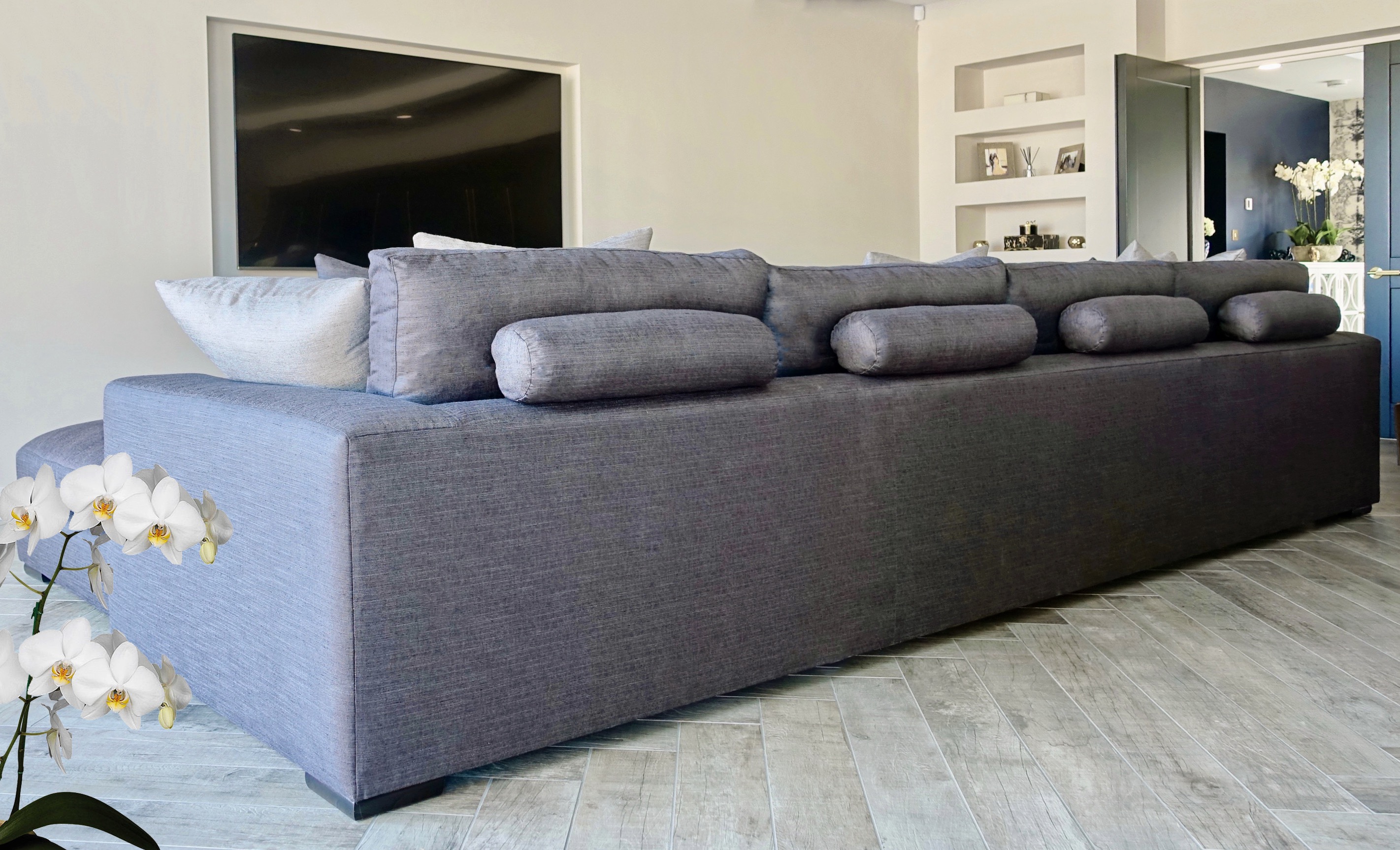 Dark blue l-shape settee with bolsters 