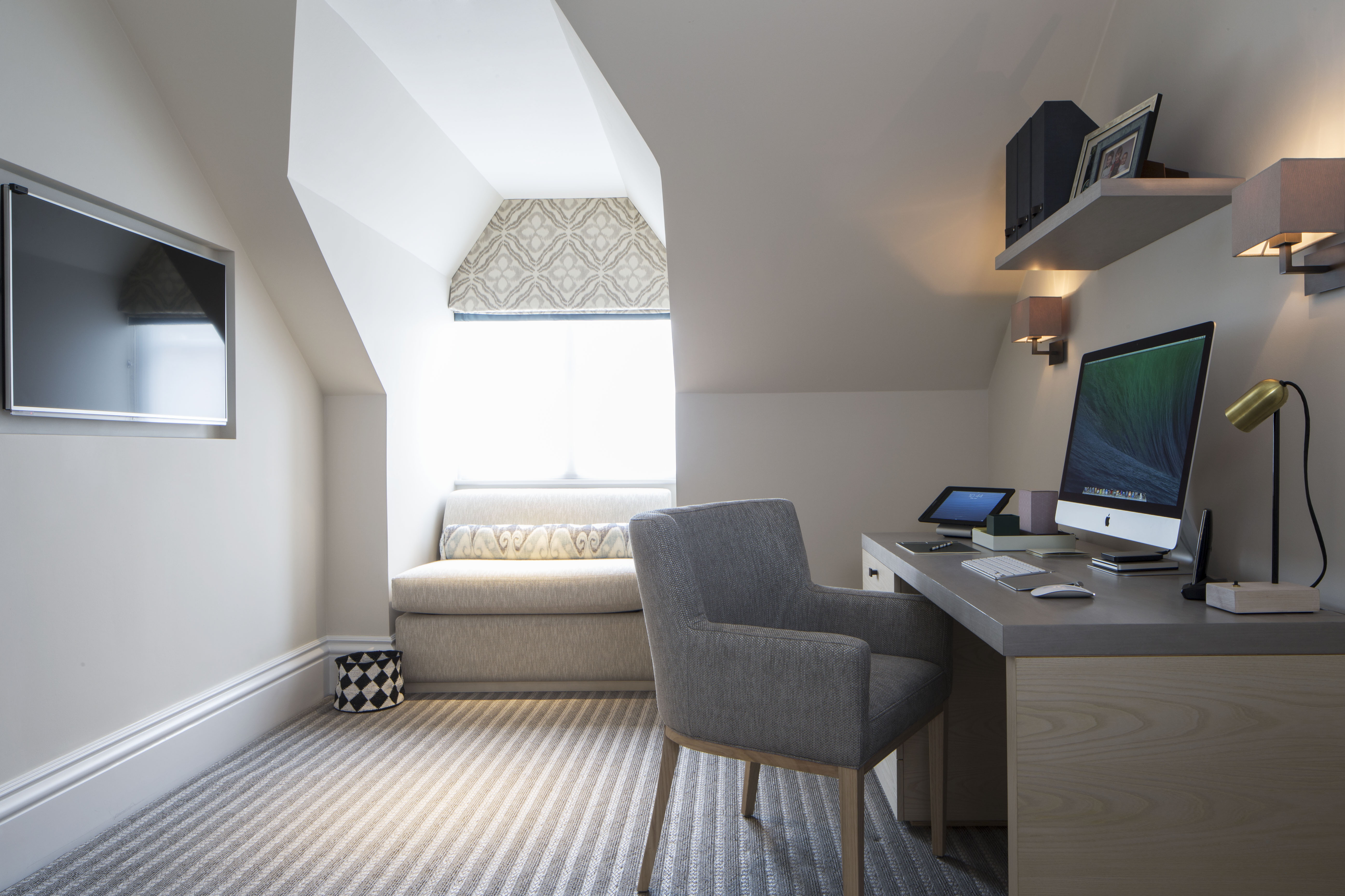 home office with desk and single sofa bed